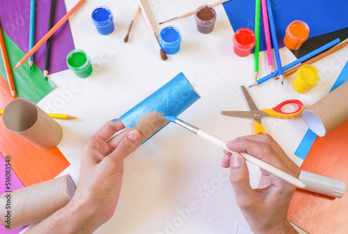 DIY paper rabbit from a roll of toilet paper. Easy craft for kids on white background, simple DIY idea from toilet tube, recycling concept. Gift ideas, decor for spring, Easter. Step by step.