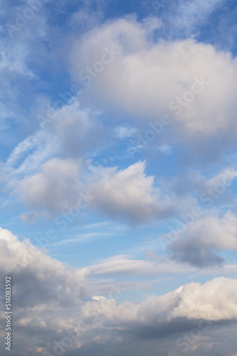 Beautiful epic soft gentle cloudy blue sky with many white cirrus and fluffy cumulus clouds  abstract background texture  heaven  