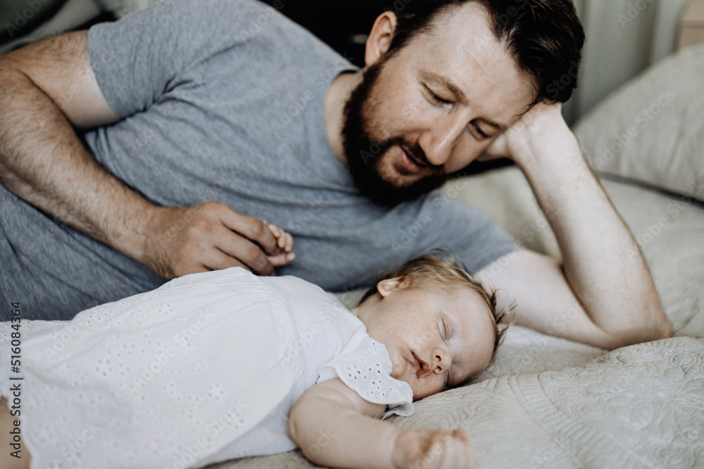 Baby sleeps with daddy on the bed Baby sleeps with daddy on the bed