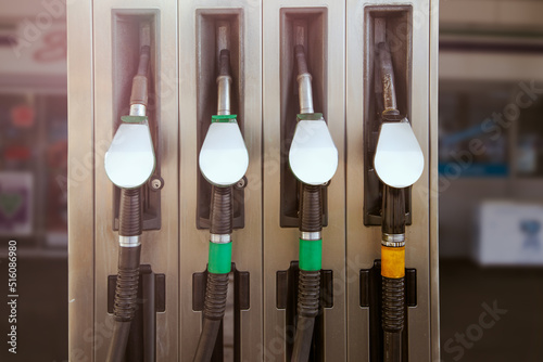 pump gas station with full nozzles to refill tank of car with gasoline and benzine mockup photo