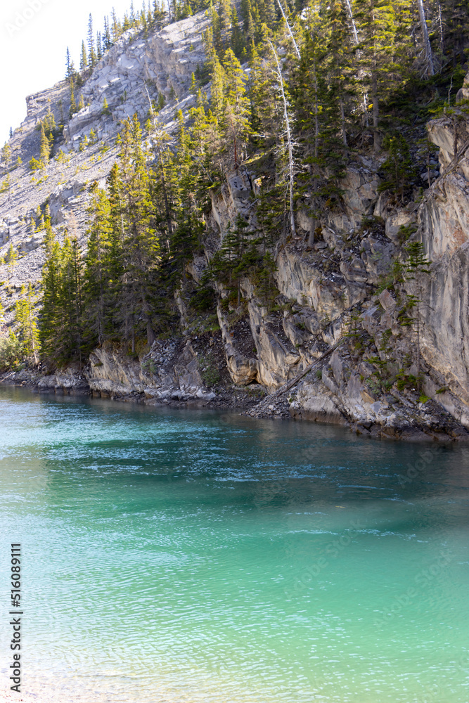 bright water along cliff side bright water along cliff side