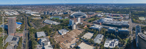 Panoramic aerial drone view of Sydney Olympic Park, an Inner West suburb of Sydney, NSW, Australia on a sunny day   © Steve