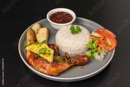 Typical Costa rican casado with rice and beans, salad, meat photo