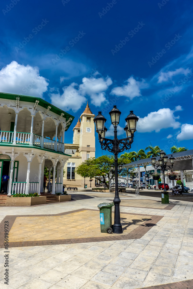 Fototapeta premium Central Park of Puerto Plata, Dominican Republic featuring ancient Cathedral, City Hall, multiple historical buildings and famous landmarks - July 2, 2022.