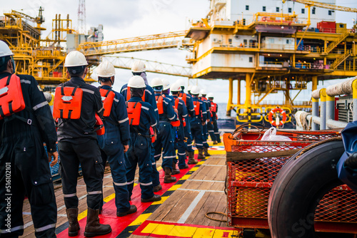 Offshore queuing workers work on decks during disembarkation operations to rest on the rig.