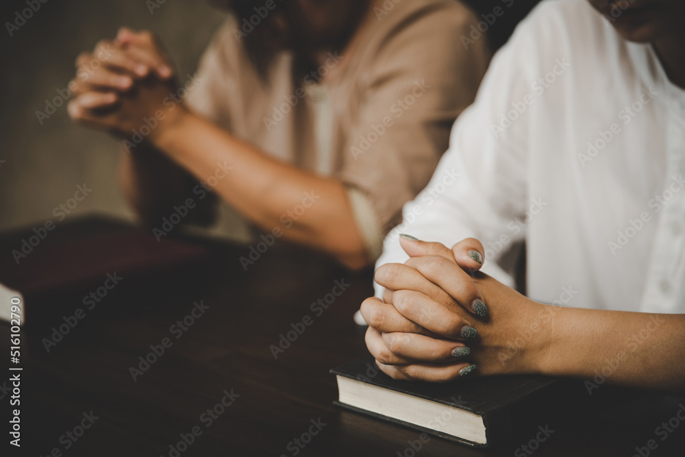  Two women praying worship believe