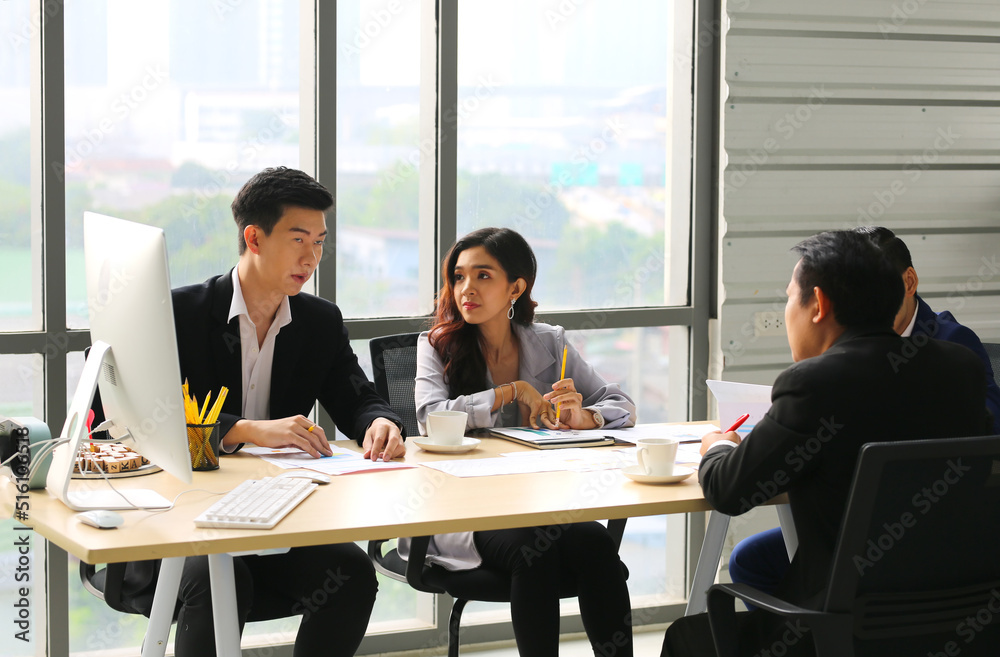 Businessman Giving Speech On Business Meeting With Colleagues, Discussing Work Ideas And Projects, Making Presentation Standing In Modern Office. Teamwork, Entrepreneurship, Corporate Meeting Businessman Giving Speech On Business Meeting With Colleagues, Discussing Work Ideas And Projects, Making Presentation Standing In Modern Office. Teamwork, Entrepreneurship, Corporate Meeting