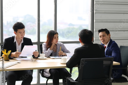 Businessman Giving Speech On Business Meeting With Colleagues, Discussing Work Ideas And Projects, Making Presentation Standing In Modern Office. Teamwork, Entrepreneurship, Corporate Meeting