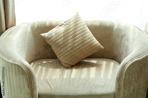 Fototapeta Naklejka Na Ścianę i Meble -  Cushions on a cream sofa