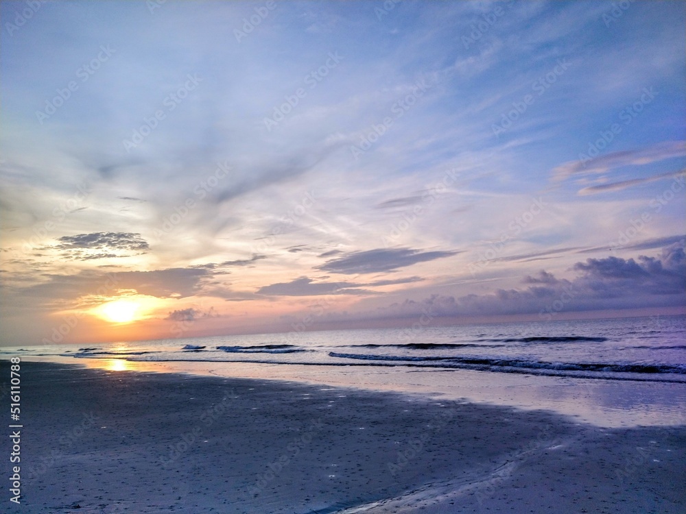 Peaceful Beach Sunrise Over Waves
