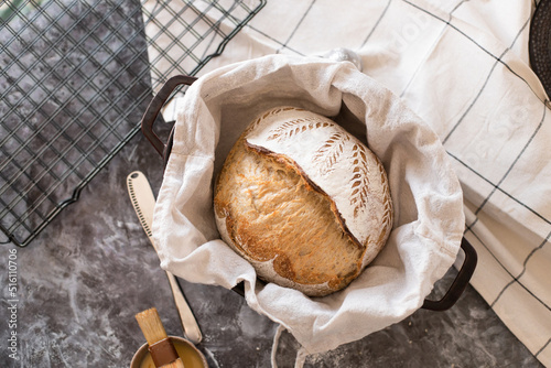 Yeast-free bread with a beautiful pattern, rich pastries at home on a black grate in the kitchen. photo