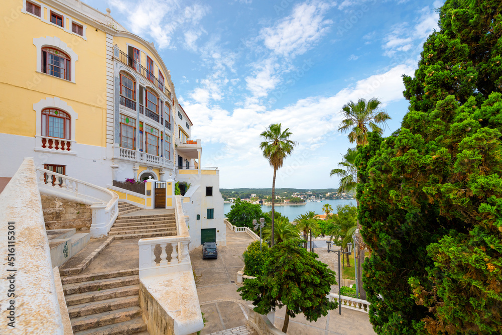 View of the Georgian architecture, Mediterranean Sea and port harbor from the grand staircase leading to the historic old town of Mahon or Mao on the Island of Menorca, Spain.