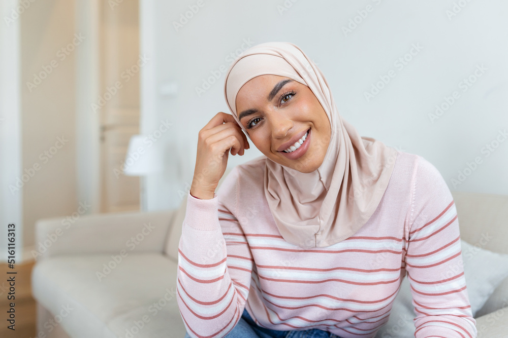 Portrait young muslim woman in headscarf smile.Happy moment concept. Headshot of a beautiful Muslim female model in a casual wear and hijab Portrait young muslim woman in headscarf smile.Happy moment concept. Headshot of a beautiful Muslim female model in a casual wear and hijab