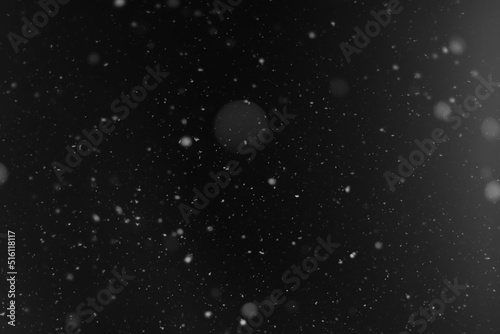 Snow background. Snow on a black background. Snowflakes for overlay. © alexkich