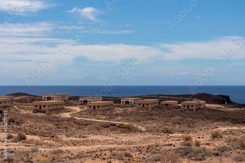 Panoramic sea view on the abandoned leper village of Sanatorio de Abona near Abades beach, east coast Tenerife Spain. Pueblo fantasma de Abades, an unnfinished project of leprosy hospital. Ghost town