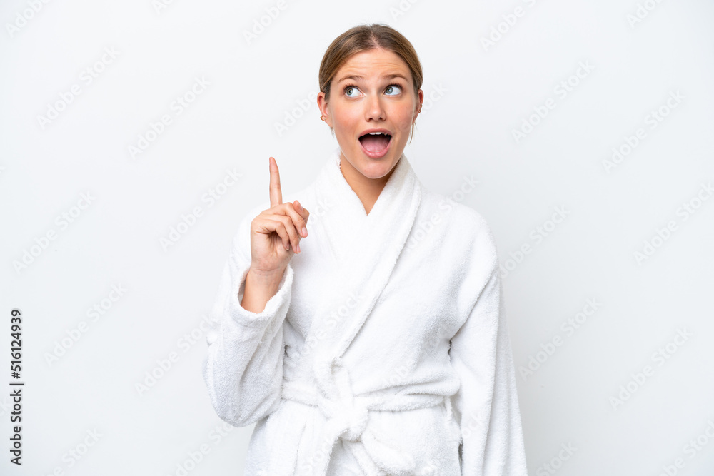 Young pretty blonde woman in bathrobe isolated on white background thinking an idea pointing the finger up Young pretty blonde woman in bathrobe isolated on white background thinking an idea pointing the finger up
