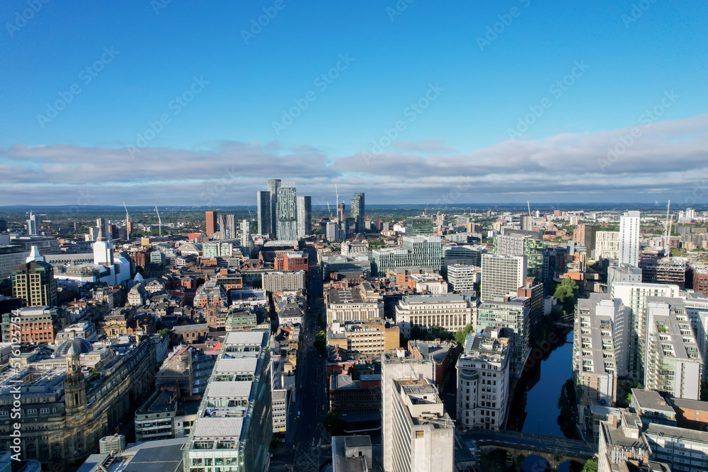 Obraz premium Manchester City Centre Drone Aerial View Above Building Work Skyline Construction Blue Sky Summer 2022