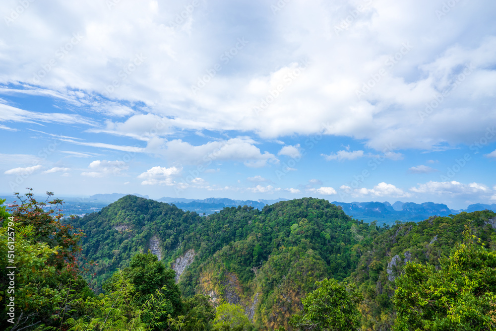 mountains with sky and clouds as seen from Tiger Cave Temple (Wat Tham Sua) in Krabi, Thailand.