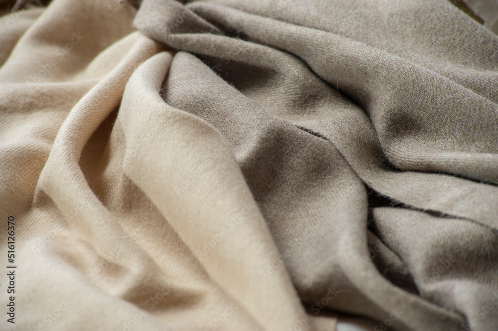 Fototapeta premium background from natural fabrics. cozy fabrics in pastel and autumn shades with texture and light defocus for the background