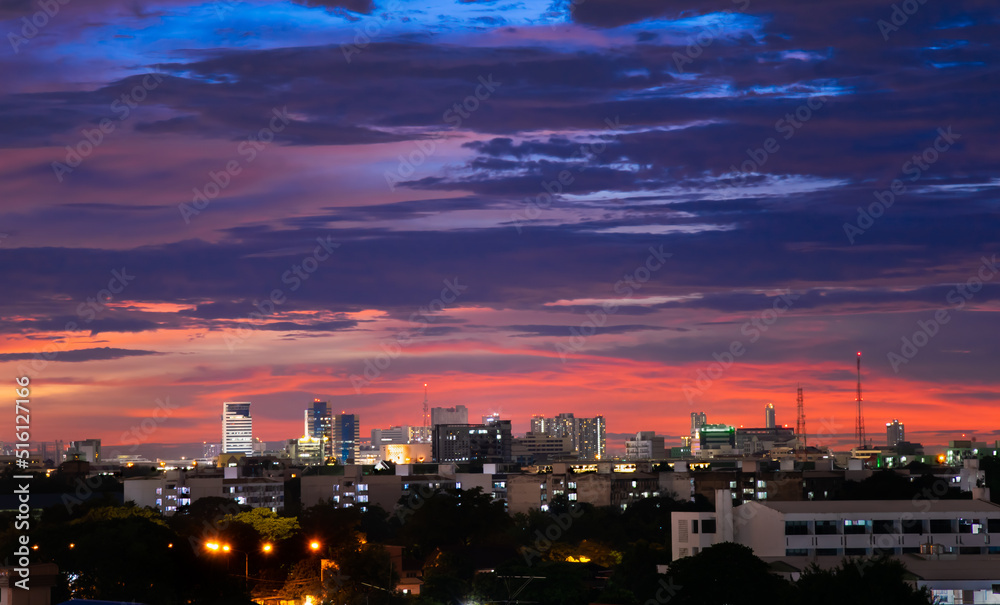 Naklejka premium The colorful sky at sunset during twilight after the rain, gives a dramatic feeling, a bird-eye view of the city at twilight, a beautiful sky with clouds,Sky background with clouds,Nature abstract.