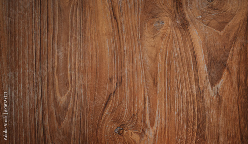 Brown wood texture background coming from natural tree. Walnut wooden panel has a beautiful dark pattern, hardwood floor texture
