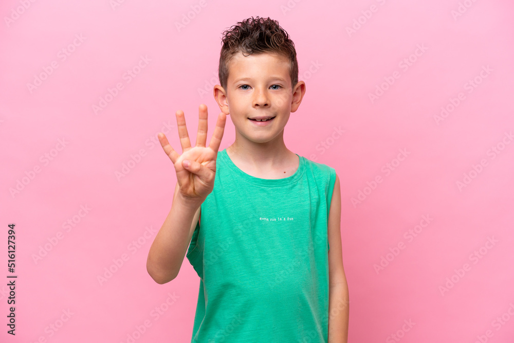 Little caucasian boy isolated on pink background happy and counting four with fingers Little caucasian boy isolated on pink background happy and counting four with fingers