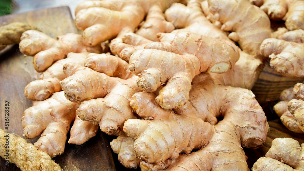 Fresh ginger root. Foods containing vitamin C. Free space for text on a stone background. Fresh ginger root. Foods containing vitamin C. Free space for text on a stone background.