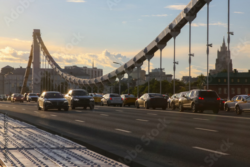 Krymsky Bridge or Crimean Bridge, Moscow, moving cars on the bridge photo