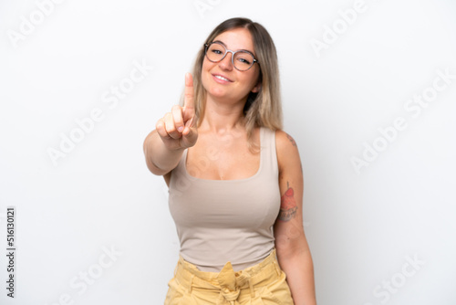 Young Rumanian woman isolated on white background showing and lifting a finger