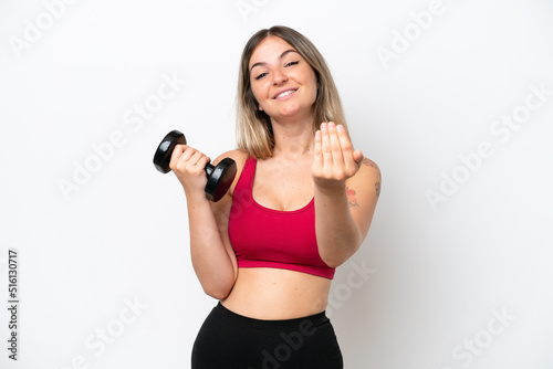 Young sport Rumanian woman making weightlifting isolated on white background inviting to come with hand. Happy that you came