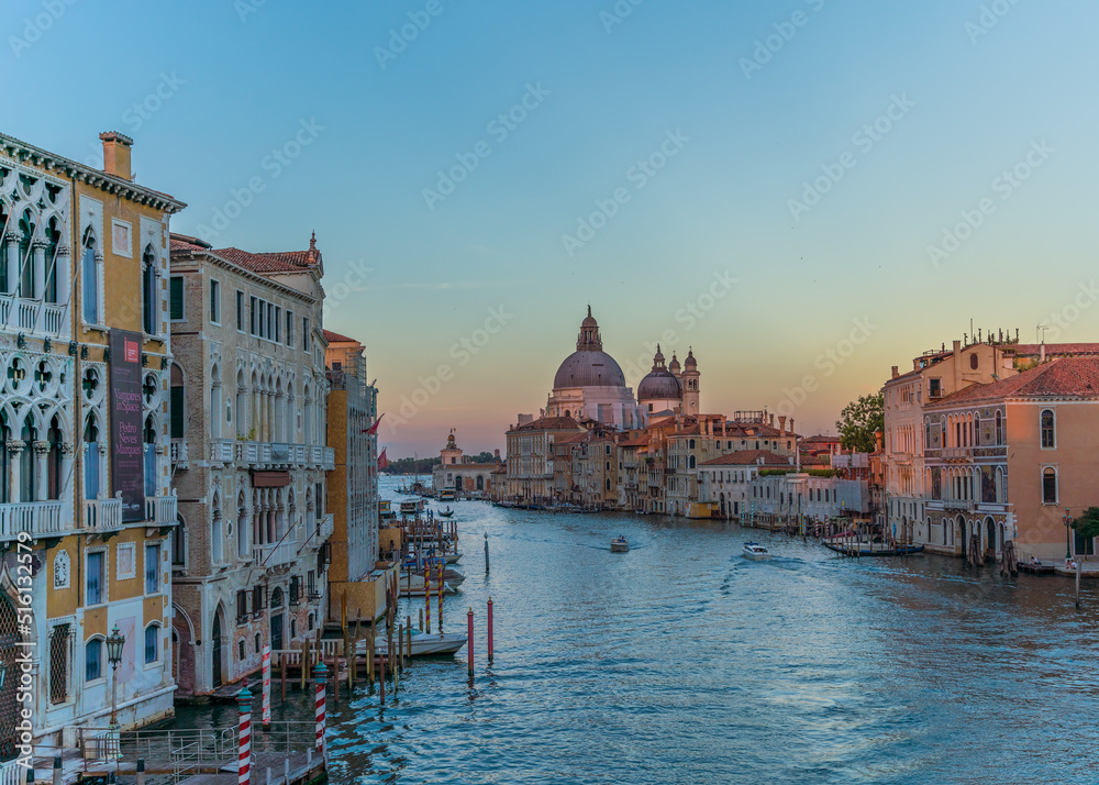 Incredible sunset view and traditional venetian architecture seen from the grand canal in Venice, Italy