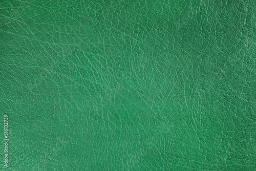 Natural, artificial green leather texture background. Material for sport items, clothes, furnitre and interior design. ecological friendly leatherette. photo