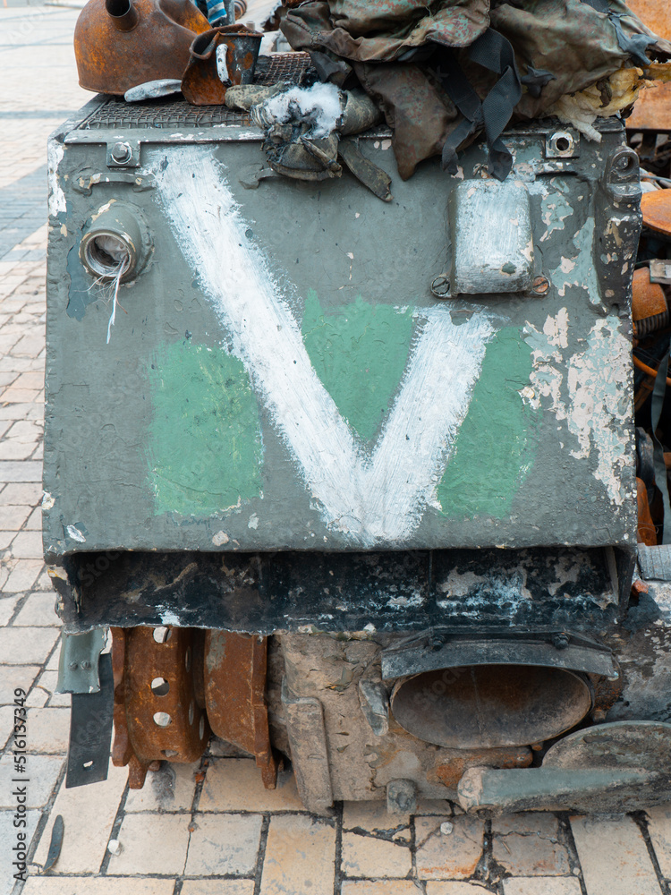 Sign V on a damaged Russian armored vehicle. Military conflict in Ukraine 2022 Sign V on a damaged Russian armored vehicle. Military conflict in Ukraine 2022