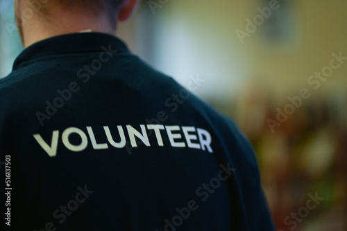 Back of volunteer in his t-shirt