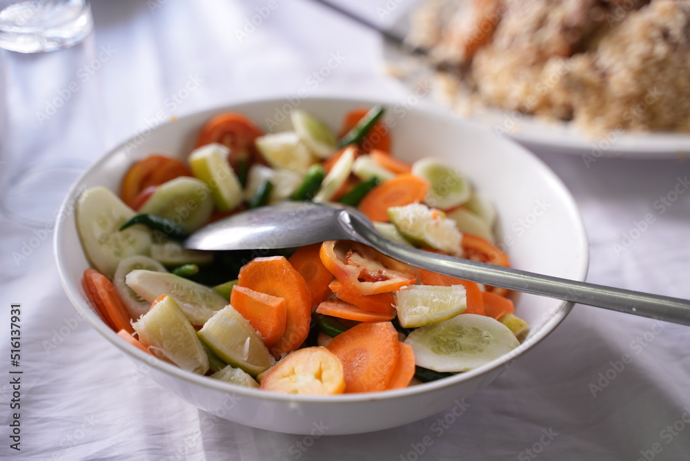 Bunch of Indian curry dishes served on a wooden table