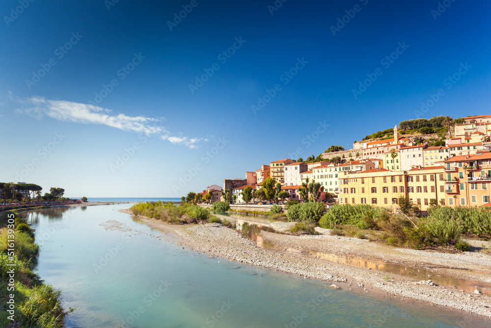 Colorful houses of Ventimiglia near river mouth Roya