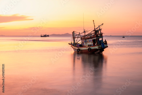 Boat Moored In Sea Against Sky During Sunset