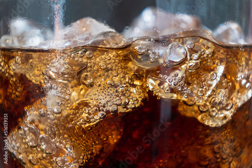 close up Soft drink glass with ice splash
