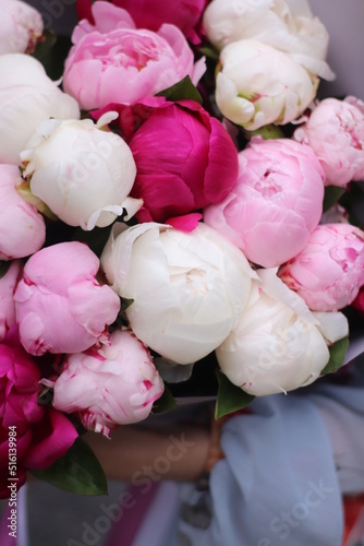 flowers of pink and white peonies close-up in a bouquet