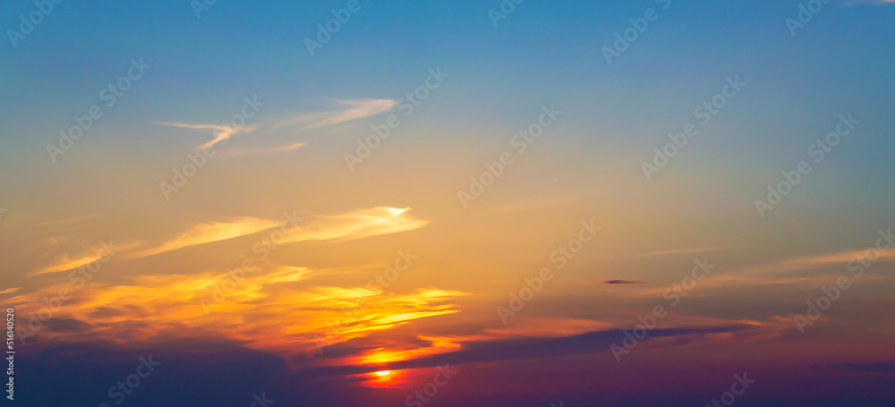 Sky with wispy clouds at sunset. Atmosphere background