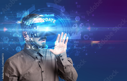 Businessman looking through VR glasses