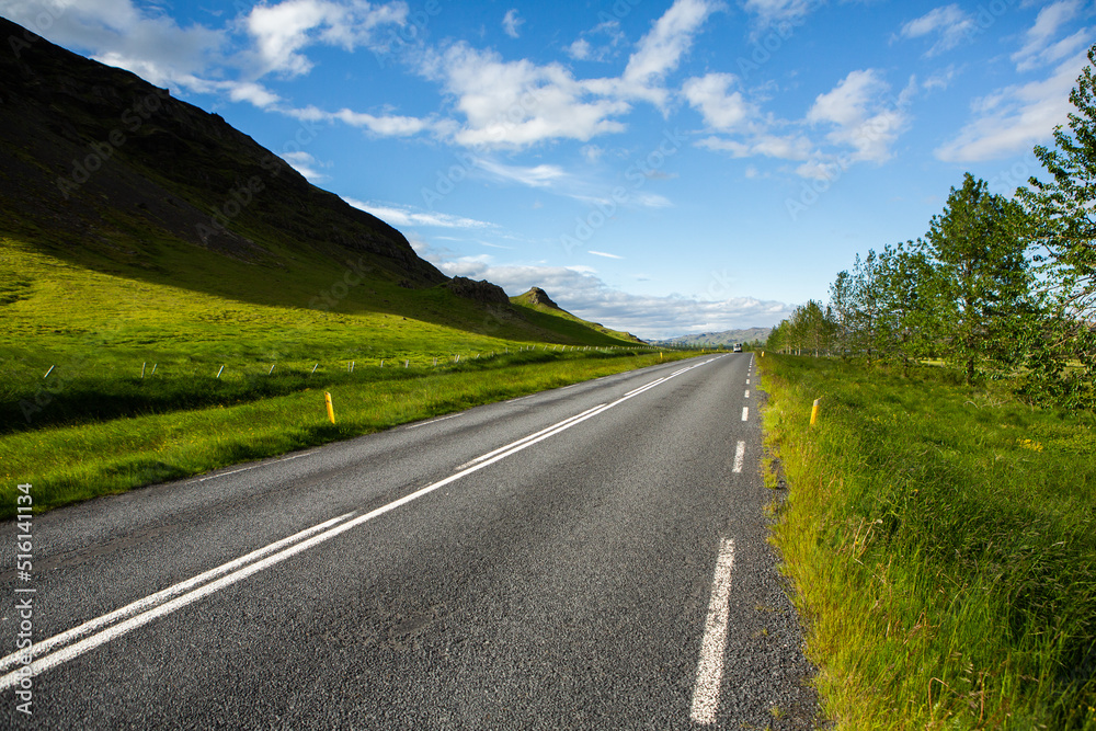 Very picturesque empty road in iceland in summer. Asphalt road as a symbol of freedom and travel. Very picturesque empty road in iceland in summer. Asphalt road as a symbol of freedom and travel.