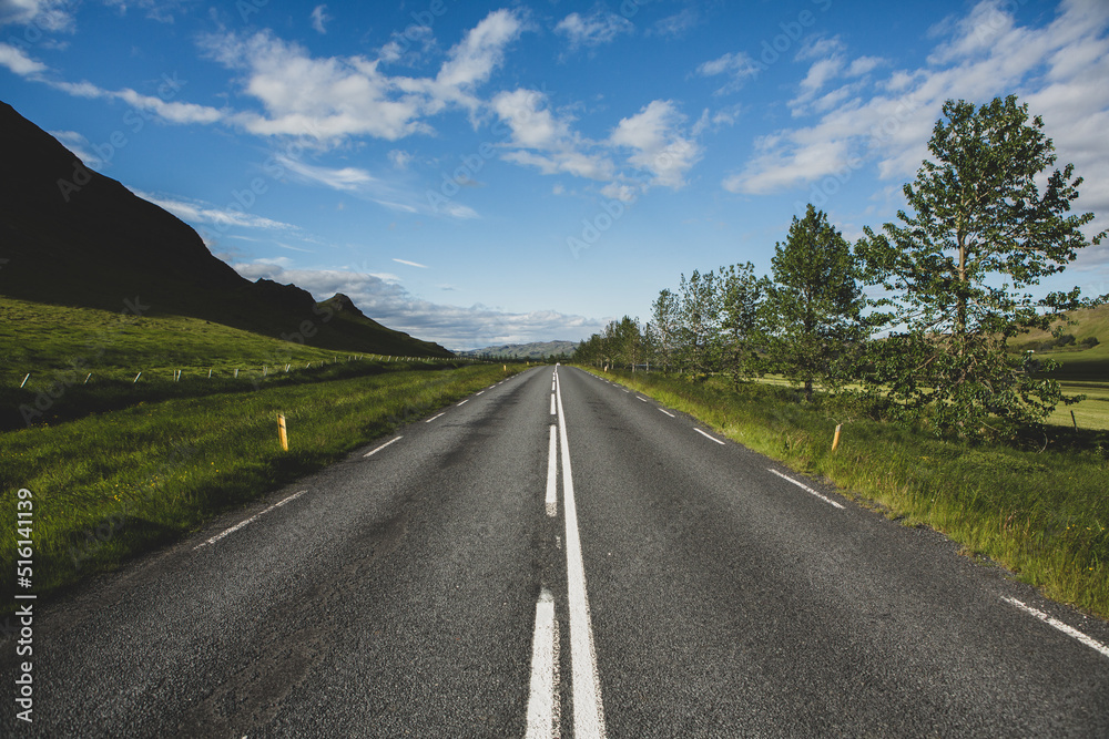 Very picturesque empty road in iceland in summer. Asphalt road as a