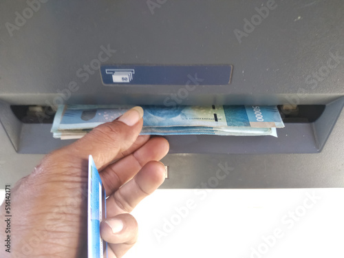 withdraw money at atm. ecomomy, business, technology photo