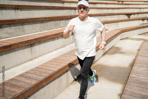 Male pensioner gray-haired running exercise fitness workout