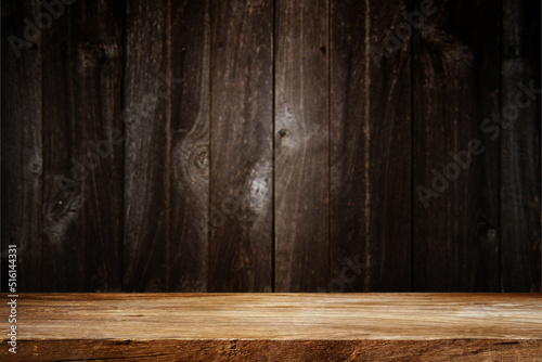 Wooden table in dark room background concept for advertising.   © Studio Sun