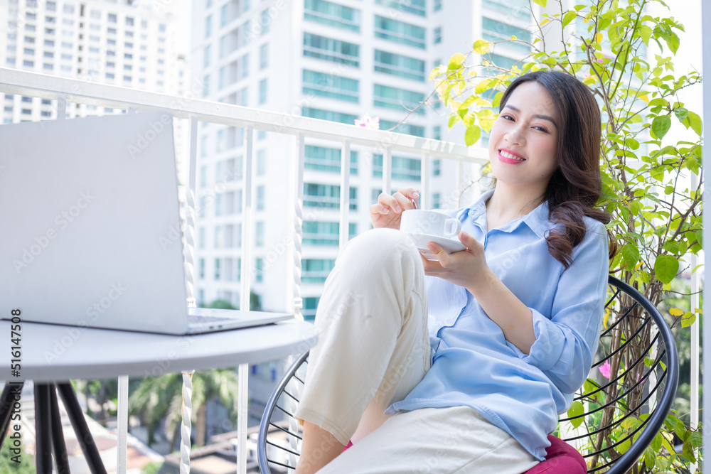 Image of young Asian business woman working at home