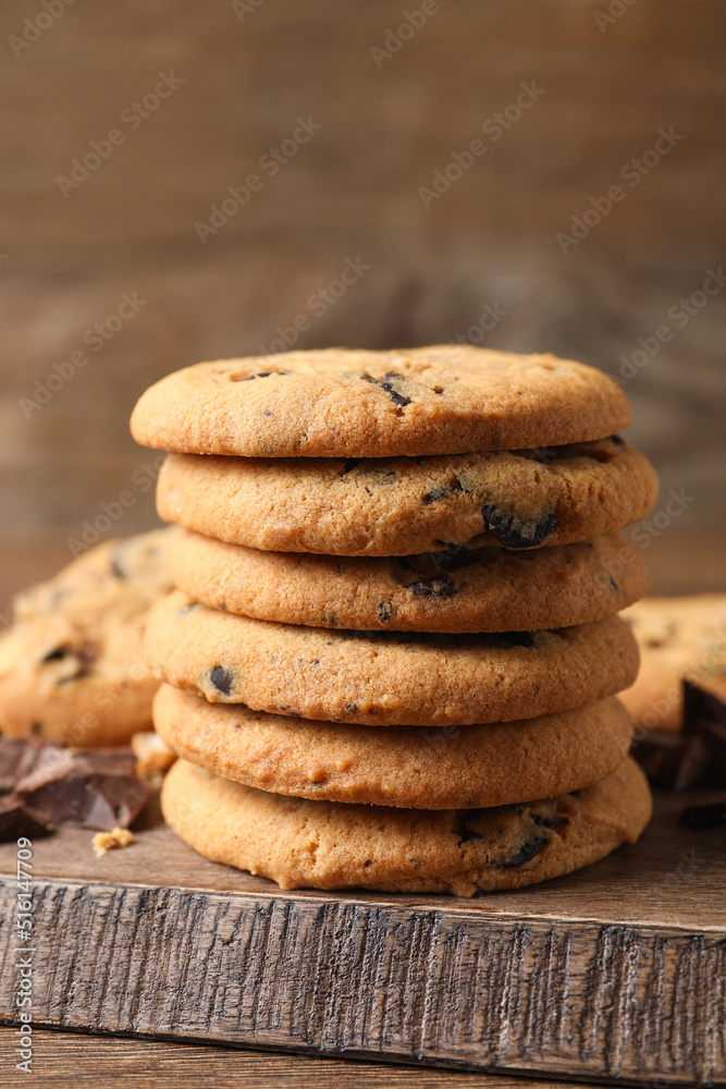 Delicious chocolate chip cookies on wooden table Delicious chocolate chip cookies on wooden table