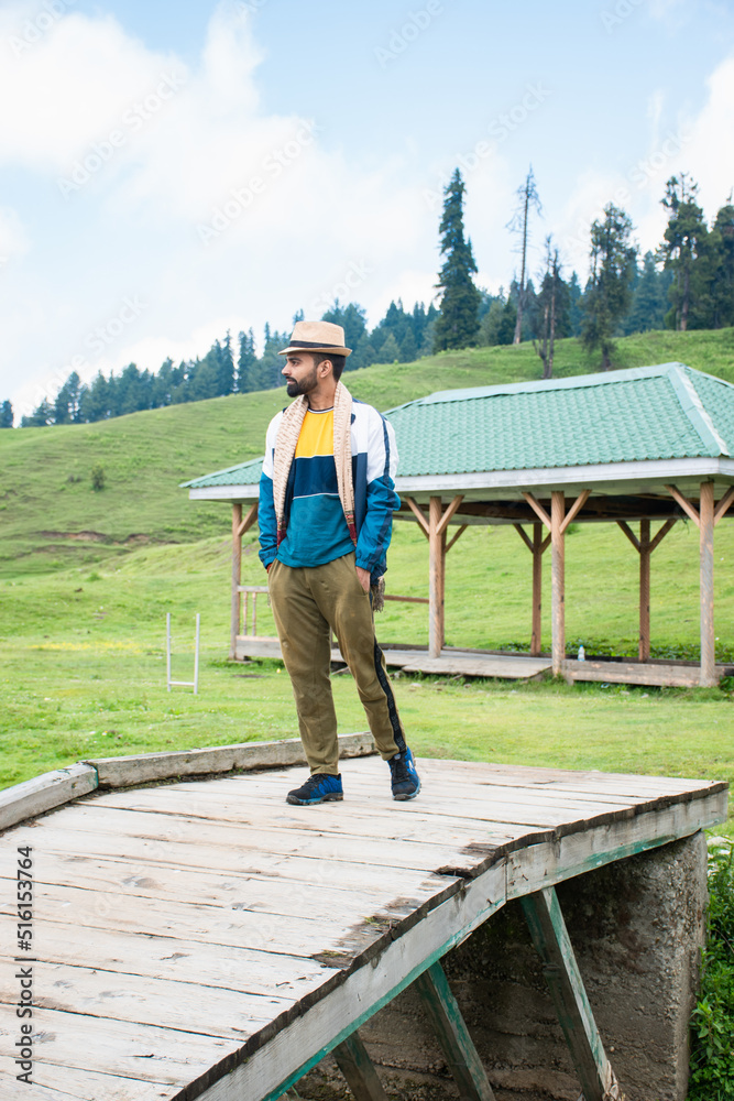 A Man walking on a bridge in Gulmarg, Srinagar, Jammu and Kashmir In India.