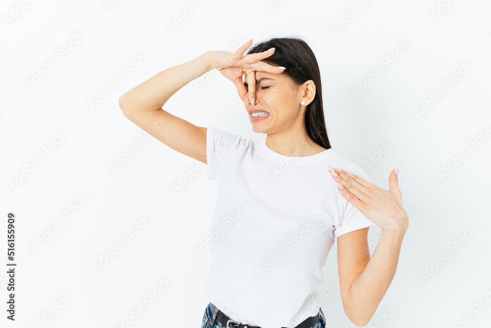 Young woman feels something stinks